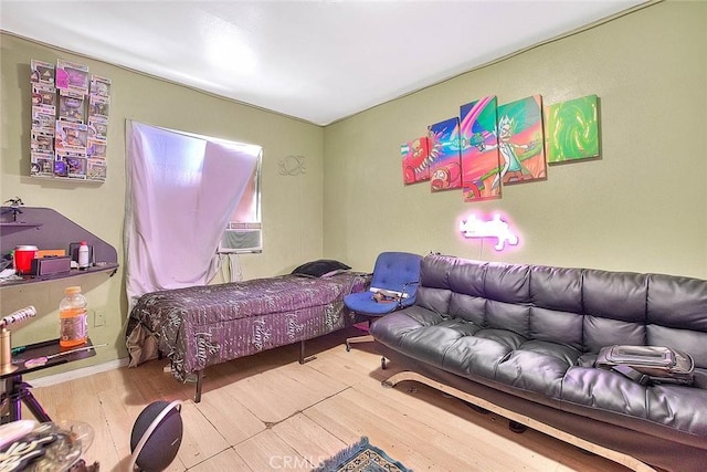 bedroom featuring wood finished floors