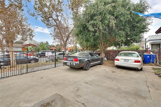 view of car parking with fence