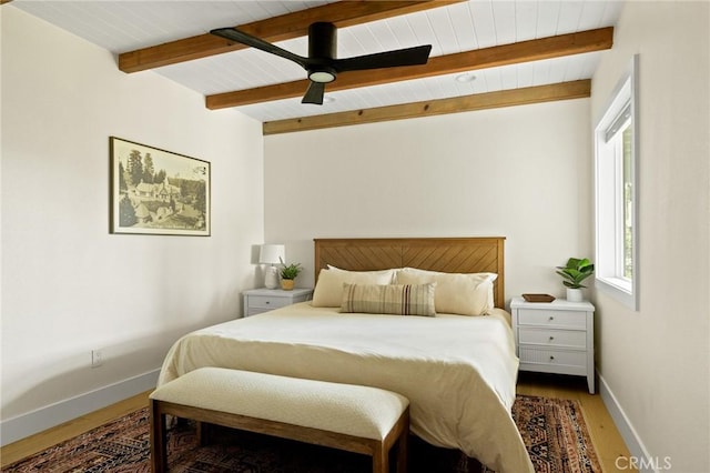 27684 St Bernard Ln, Lake Arrowhead, CA 92352 - bedroom with baseboards, multiple windows, beamed ceiling, and wood finished floors