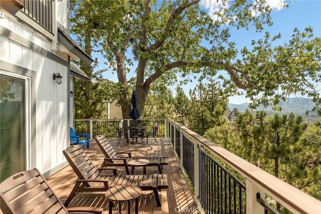 27684 St Bernard Ln, Lake Arrowhead, CA 92352 - wooden terrace with outdoor dining area