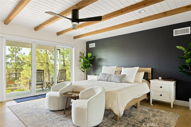 27684 St Bernard Ln, Lake Arrowhead, CA 92352 - bedroom with visible vents, light wood-type flooring, beam ceiling, and access to exterior