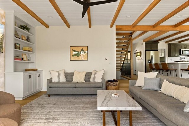 27684 St Bernard Ln, Lake Arrowhead, CA 92352 - living area with stairs, light wood finished floors, ceiling fan, and beamed ceiling