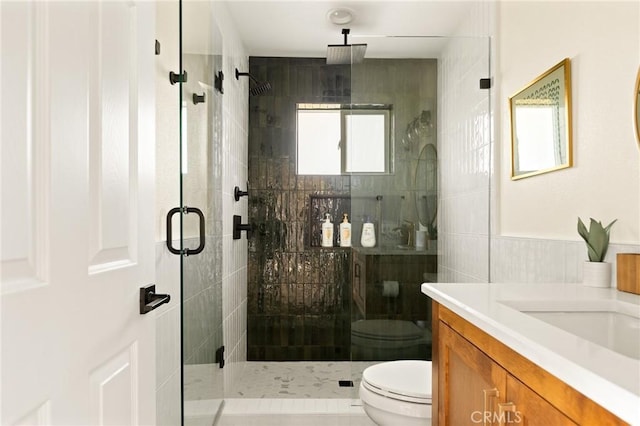 27684 St Bernard Ln, Lake Arrowhead, CA 92352 - bathroom with a stall shower, vanity, and tile walls