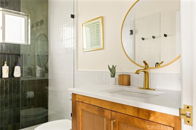 27684 St Bernard Ln, Lake Arrowhead, CA 92352 - full bath with vanity, toilet, tile walls, and a stall shower