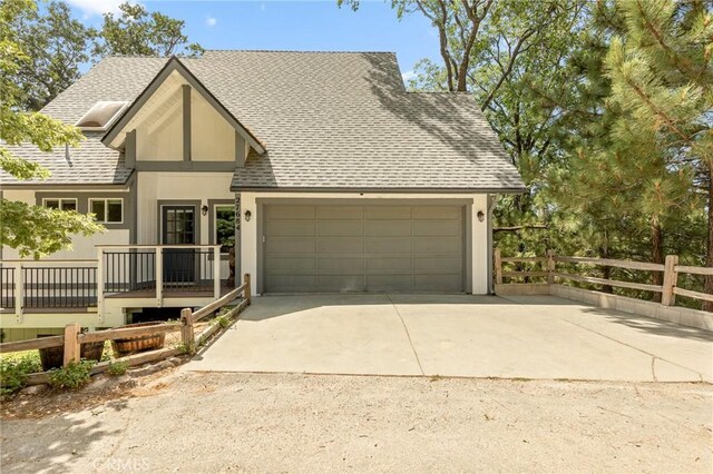 27684 St Bernard Ln, Lake Arrowhead, CA 92352 - view of front of property with roof with shingles, fence, concrete driveway, an attached garage, and stucco siding