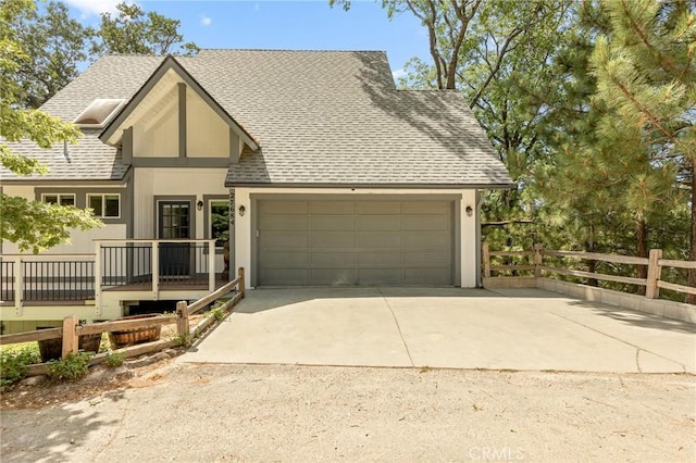 27684 St Bernard Ln, Lake Arrowhead, CA 92352 - view of front of property featuring a shingled roof, concrete driveway, a garage, and stucco siding
