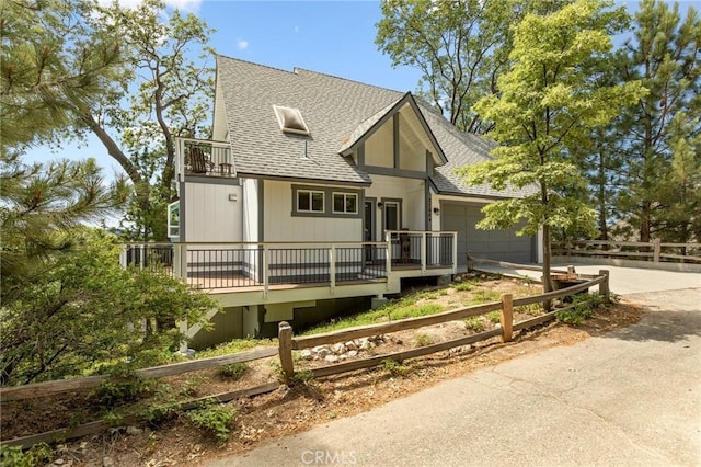 27684 St Bernard Ln, Lake Arrowhead, CA 92352 - view of front of house with fence, a shingled roof, an attached garage, and driveway