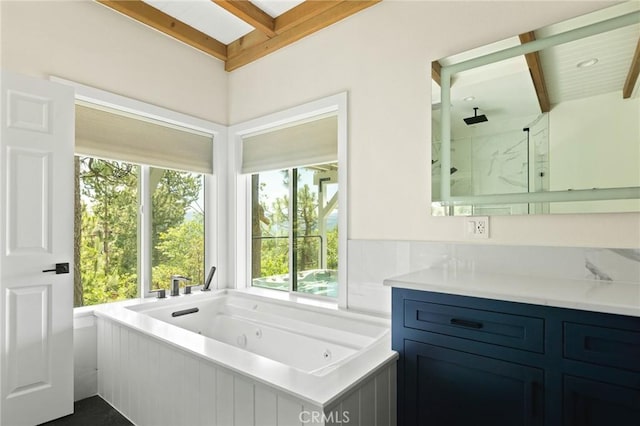 27684 St Bernard Ln, Lake Arrowhead, CA 92352 - bathroom with beam ceiling, plenty of natural light, a marble finish shower, vanity, and a jetted tub