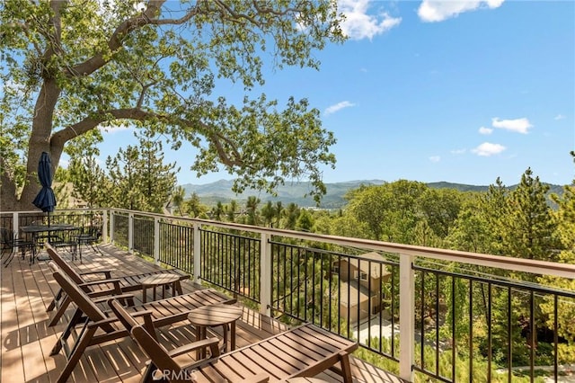 27684 St Bernard Ln, Lake Arrowhead, CA 92352 - balcony featuring outdoor dining space and a deck with mountain view