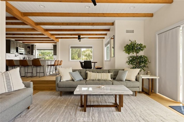 27684 St Bernard Ln, Lake Arrowhead, CA 92352 - living room with light wood-type flooring, a ceiling fan, and a wooden ceiling with exposed beams