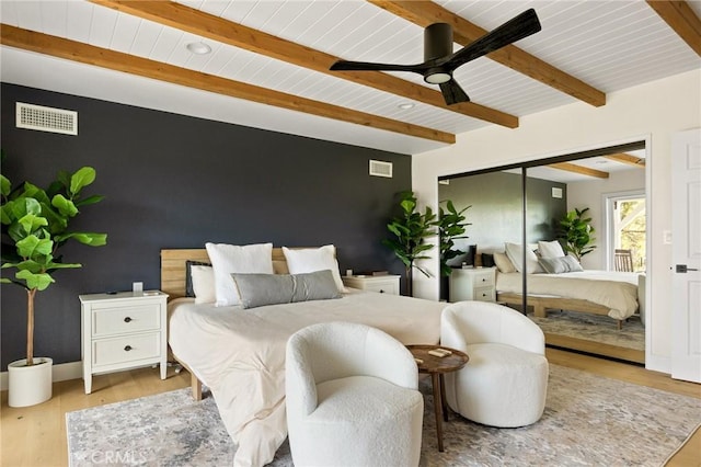 27684 St Bernard Ln, Lake Arrowhead, CA 92352 - bedroom featuring visible vents, wood finished floors, and an accent wall