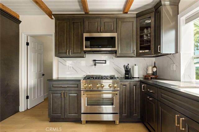 27684 St Bernard Ln, Lake Arrowhead, CA 92352 - kitchen featuring appliances with stainless steel finishes, beam ceiling, backsplash, light wood-style floors, and dark brown cabinets