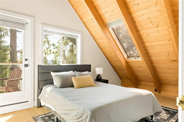 27684 St Bernard Ln, Lake Arrowhead, CA 92352 - bedroom with vaulted ceiling with skylight, wood ceiling, wood finished floors, and access to exterior