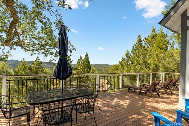 27684 St Bernard Ln, Lake Arrowhead, CA 92352 - deck featuring a mountain view and outdoor dining area