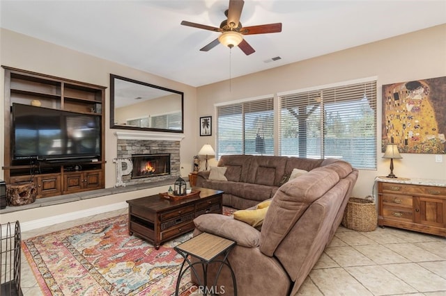 37549 Windsor Ct, Murrieta, CA 92562 - living room with visible vents, a ceiling fan, light tile patterned flooring, and a fireplace