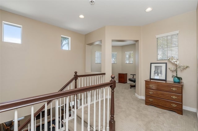 37549 Windsor Ct, Murrieta, CA 92562 - hallway featuring light carpet, recessed lighting, an upstairs landing, and a wealth of natural light