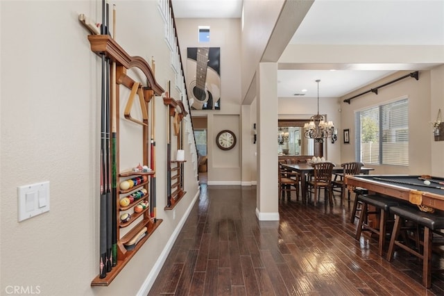 37549 Windsor Ct, Murrieta, CA 92562 - hall featuring dark wood-type flooring, a chandelier, and baseboards