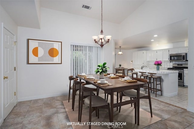 42852 Badger Circle Dr, Coarsegold, CA 93614 - dining space with high vaulted ceiling, visible vents, recessed lighting, a chandelier, and baseboards
