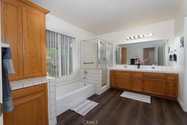 42852 Badger Circle Dr, Coarsegold, CA 93614 - full bathroom with a sink, a bath, a shower stall, and wood finished floors