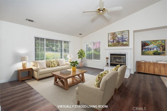 42852 Badger Circle Dr, Coarsegold, CA 93614 - living area featuring dark wood finished floors, a tiled fireplace, baseboards, and ceiling fan