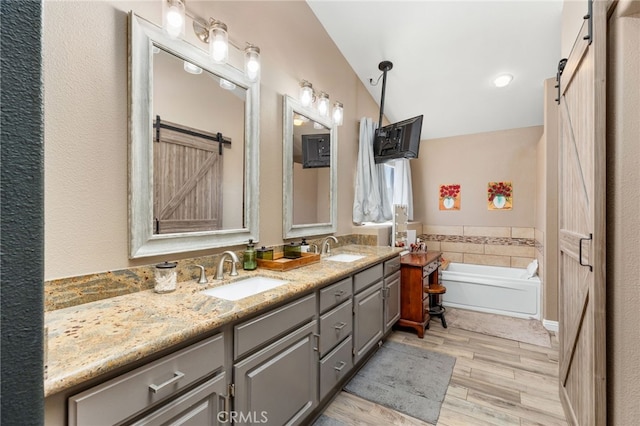 27196 Swift St, Menifee, CA 92584 - full bath featuring double vanity, wood finished floors, and a garden tub
