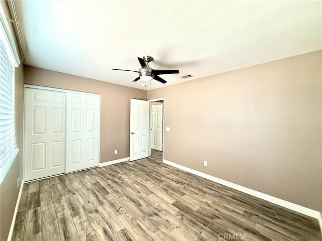 27196 Swift St, Menifee, CA 92584 - unfurnished bedroom featuring baseboards, wood finished floors, a closet, and a ceiling fan