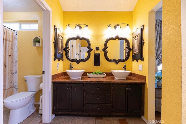 1130 Carob Ct, Hemet, CA 92545 - full bathroom with double vanity, curtained shower, and tile patterned flooring