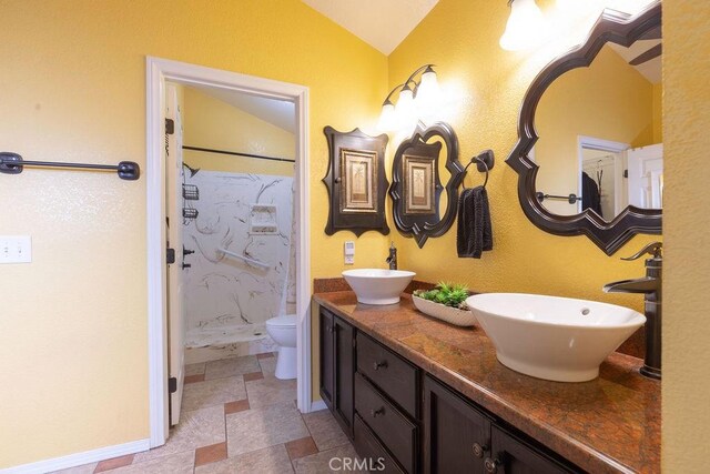 1130 Carob Ct, Hemet, CA 92545 - full bath featuring vaulted ceiling, a shower, and double vanity