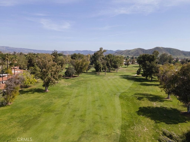 1130 Carob Ct, Hemet, CA 92545 - view of property's community with a mountain view, a yard, and view of golf course