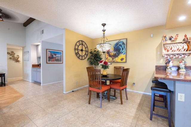 1130 Carob Ct, Hemet, CA 92545 - dining room with a textured ceiling and light tile patterned floors