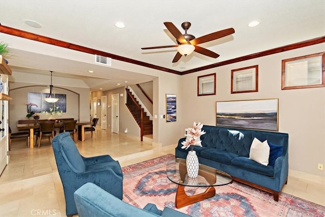 living room featuring light tile patterned floors, stairs, a ceiling fan, and baseboards