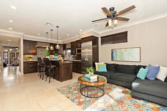 living room with light tile patterned floors, visible vents, recessed lighting, ornamental molding, and a ceiling fan