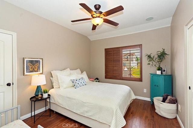 bedroom with baseboards, wood finished floors, and ceiling fan