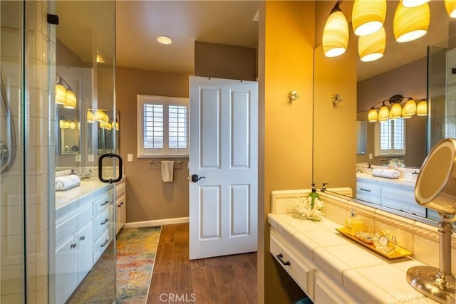 2645 S Patton Ave, San Pedro, CA 90731 - full bathroom featuring an enclosed shower, baseboards, wood finished floors, and vanity