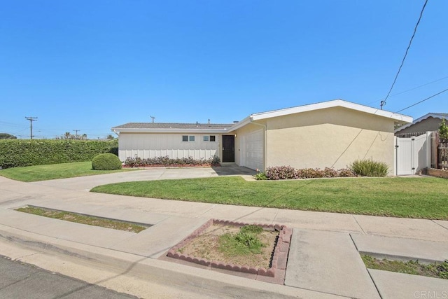 ranch-style home featuring stucco siding, driveway, a front lawn, a garage, and fence