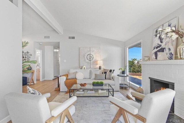 6065 Zora St, La Mesa, CA 91942 - living room featuring wood finished floors, a fireplace, and baseboards