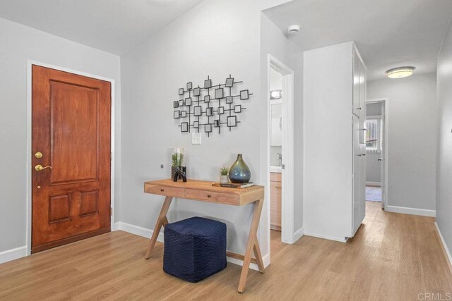 6065 Zora St, La Mesa, CA 91942 - foyer entrance with light wood-style flooring and baseboards