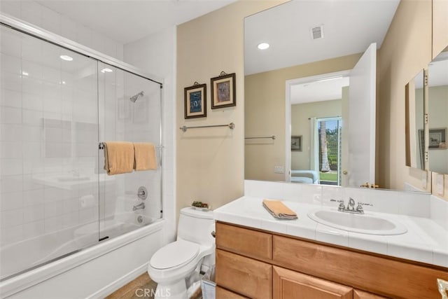 ensuite bathroom featuring vanity, toilet, visible vents, ensuite bath, and enclosed tub / shower combo