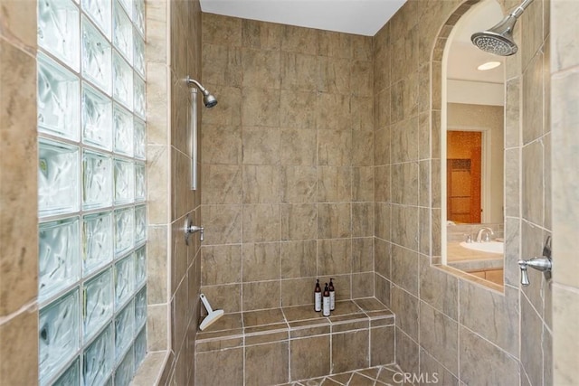 bathroom with a tile shower