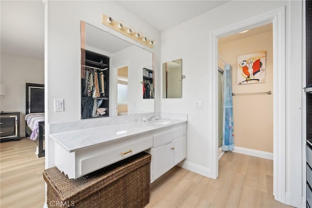 24942 Sebastian Ln, Mission Viejo, CA 92691 - full bath featuring a stall shower, baseboards, vanity, and wood finished floors