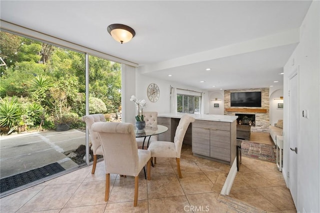 24942 Sebastian Ln, Mission Viejo, CA 92691 - dining area featuring a stone fireplace, recessed lighting, and light tile patterned flooring