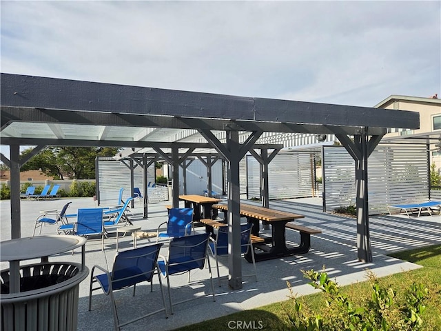 view of home's community featuring a pergola and a patio area