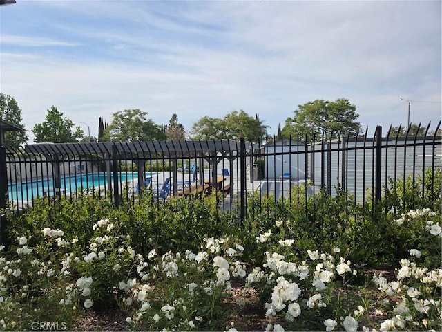 community pool featuring fence