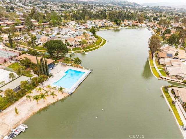 drone / aerial view with a residential view and a water view