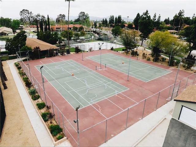 view of tennis court with fence