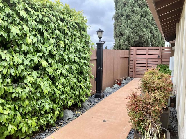 view of gate with fence