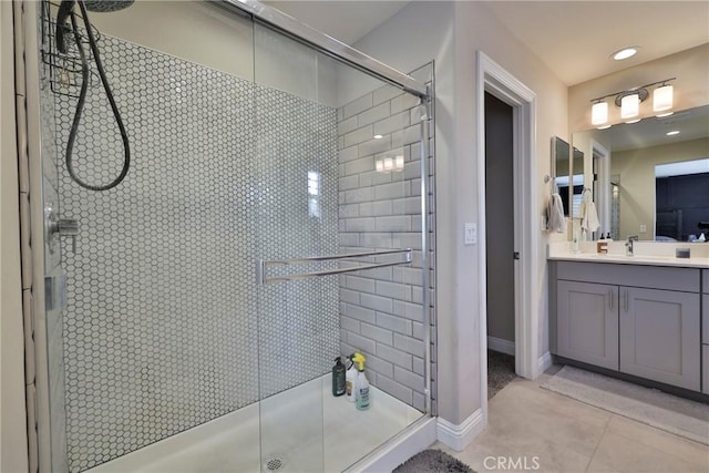 full bath with a shower stall, tile patterned flooring, recessed lighting, and vanity