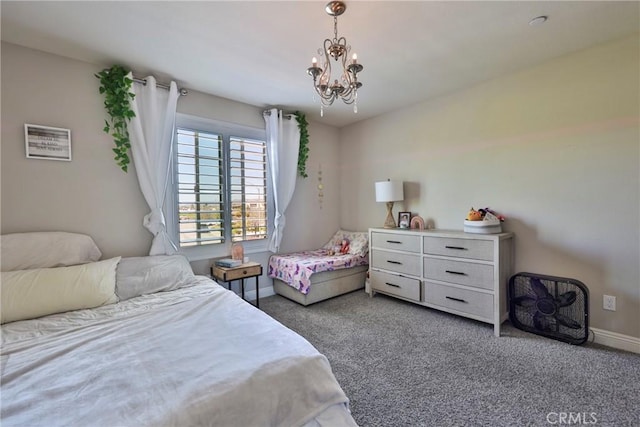 bedroom featuring baseboards, an inviting chandelier, and carpet floors