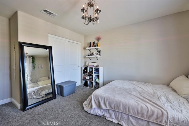 carpeted bedroom with visible vents, baseboards, a closet, and a chandelier