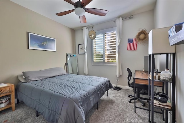 bedroom featuring baseboards, a ceiling fan, and carpet flooring